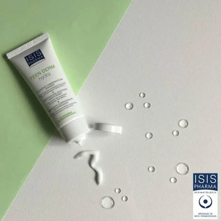 Tube of ISIS Pharma Den Derm Hydra cream on a textured surface with water droplets